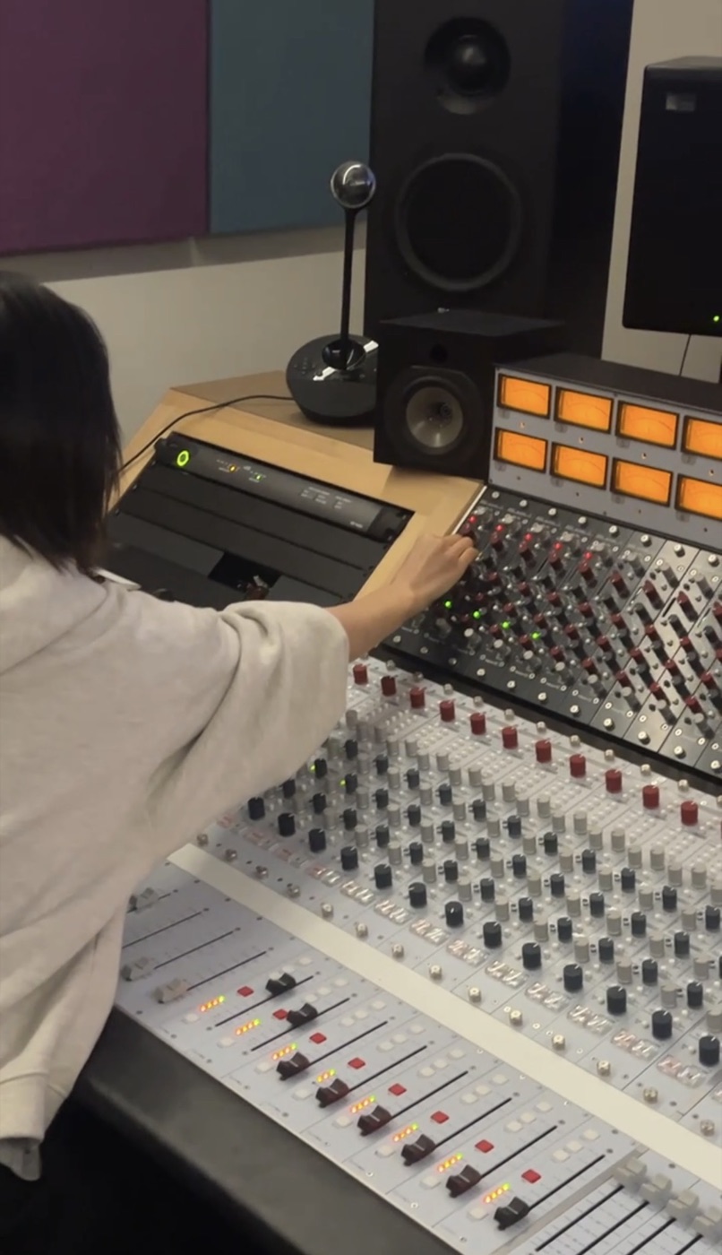 River Haeun Lee working at an analog recording console